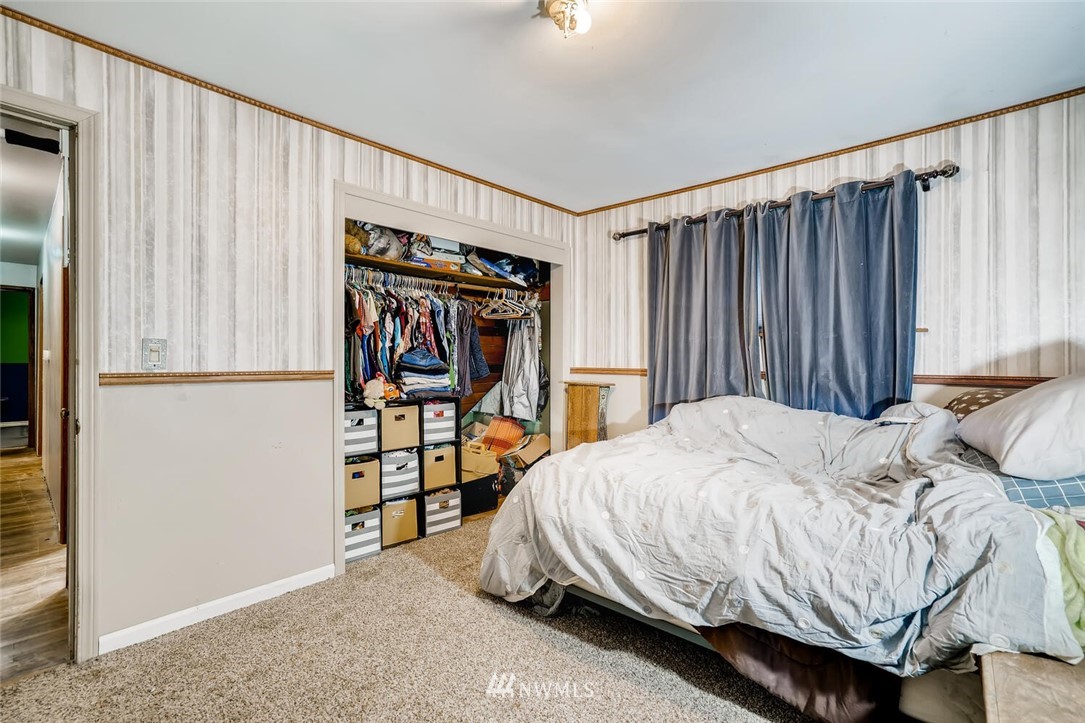 11526 Southeast Petrovitsky Road Renton, WA 98055 - Photo 13 of 28 a bedroom with a bed and a window