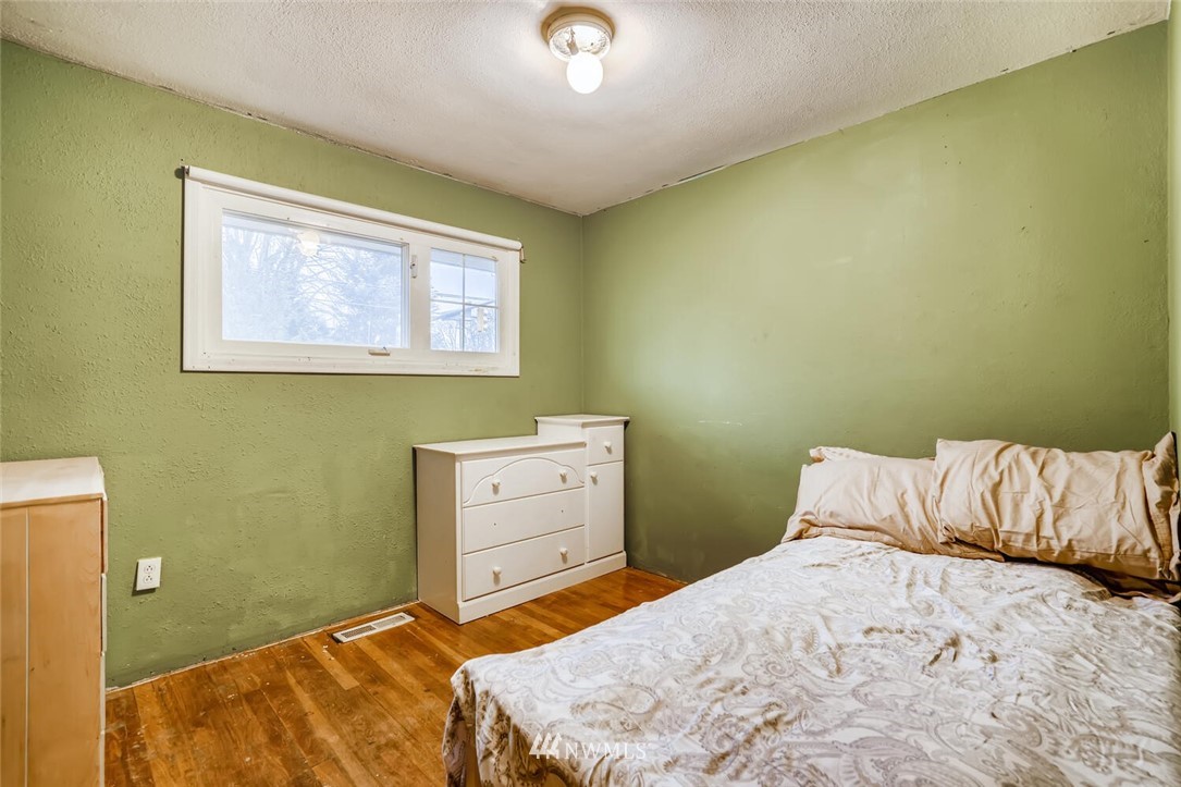11526 Southeast Petrovitsky Road Renton, WA 98055 - Photo 15 of 28 a bedroom with a bed and a window
