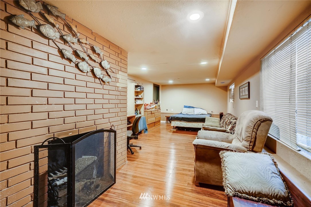 11526 Southeast Petrovitsky Road Renton, WA 98055 - Photo 17 of 28 a living room with furniture and a fireplace