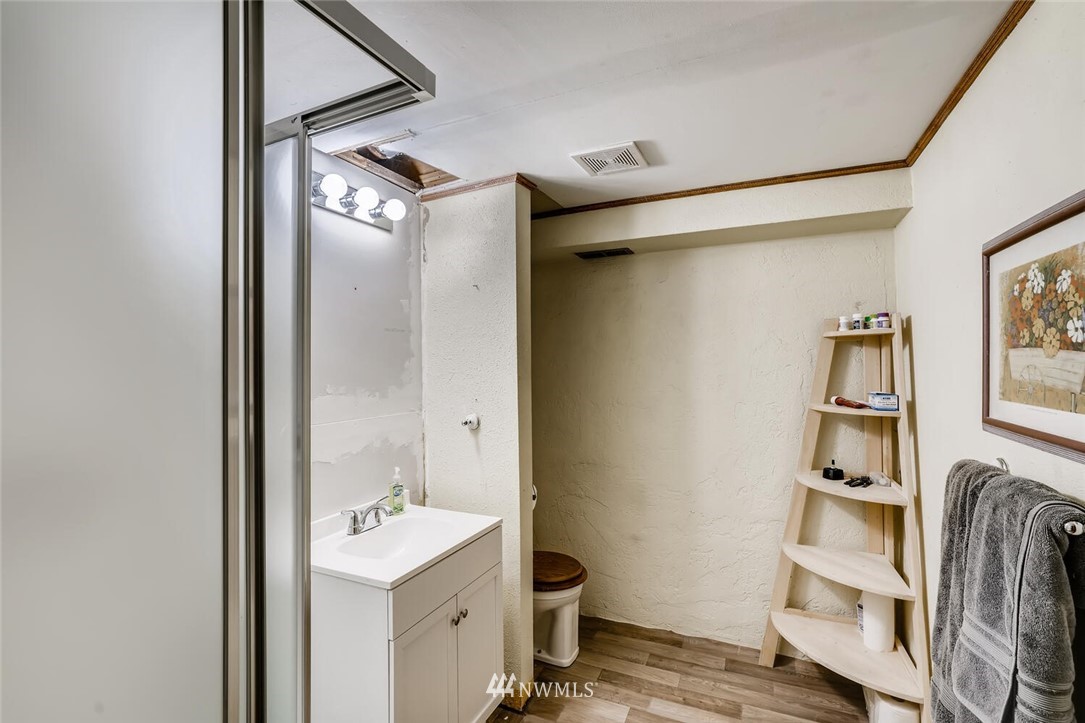 11526 Southeast Petrovitsky Road Renton, WA 98055 - Photo 20 of 28 a view of walk in closet with clothes and shoes