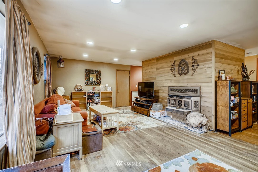 11526 Southeast Petrovitsky Road Renton, WA 98055 - Photo 5 of 28 a living room with furniture and a fireplace