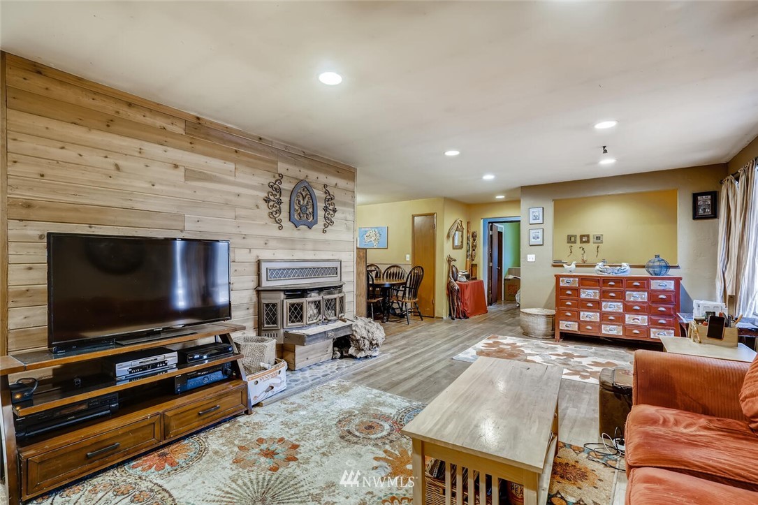 11526 Southeast Petrovitsky Road Renton, WA 98055 - Photo 7 of 28 a living room with furniture and a flat screen tv