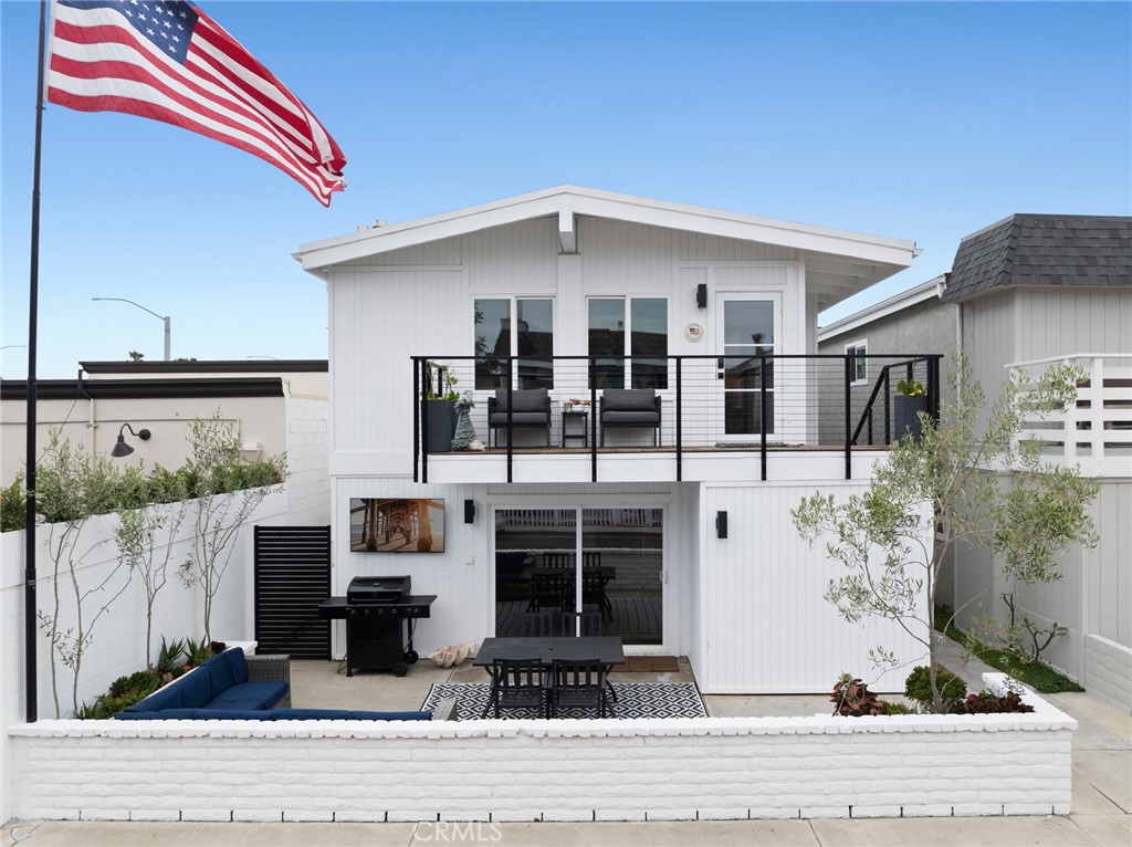 207 Colton Street Newport Beach, CA 92663 - Photo 1 of 1 a front view of a house with garage
