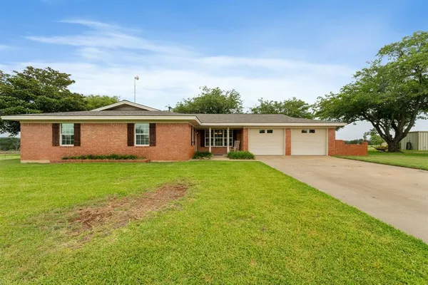 front view of a house and a yard