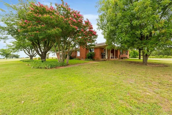 a view of a house with a garden