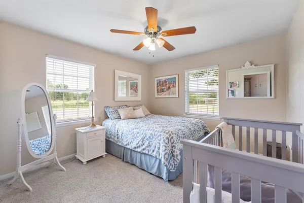 a bedroom with furniture and a window