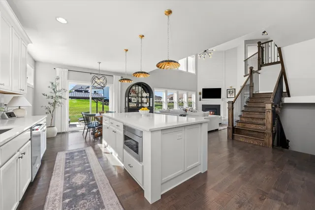 a kitchen with sink stove and refrigerator