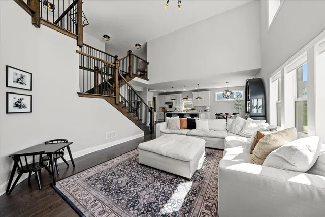 a living room with furniture and a rug