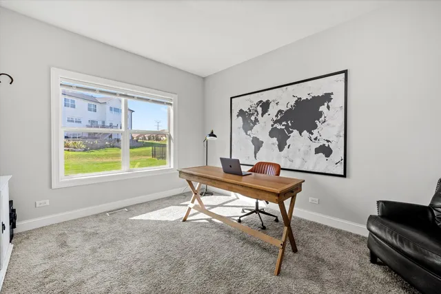 a view of a livingroom with furniture and a window