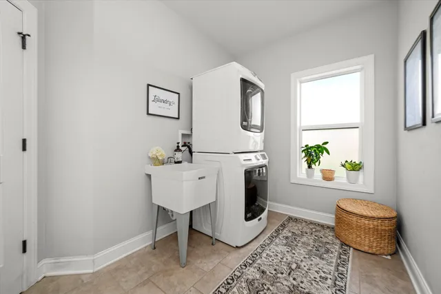 a living room with furniture a rug and a window