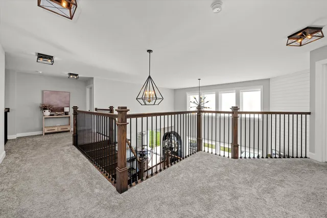 a view of a hallway with stairs