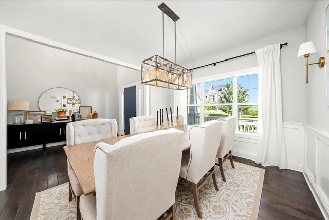 a living room with furniture a window and a table