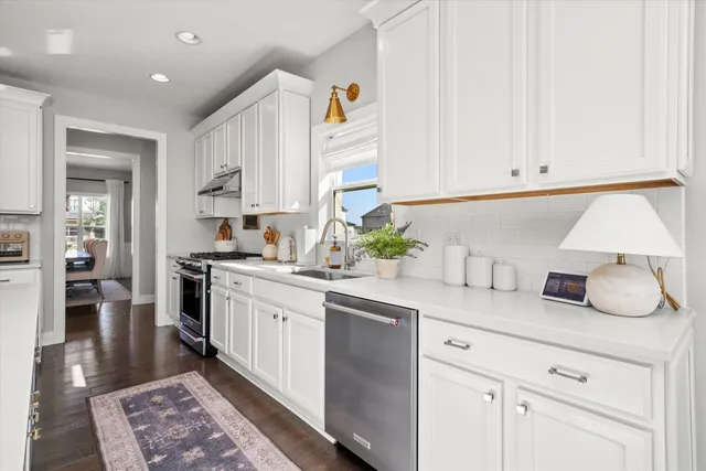 a kitchen with a sink and cabinets