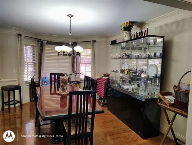 a kitchen with a refrigerator and a sink