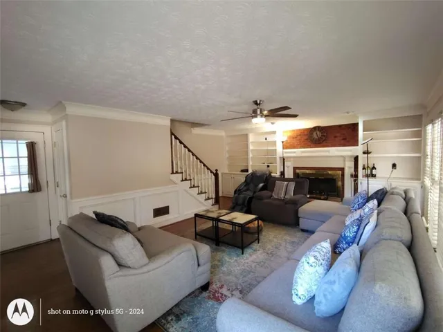 a living room with furniture and a table