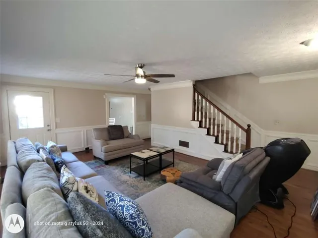 a view of a livingroom with furniture and a fireplace