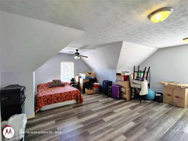 a bedroom with bed and window