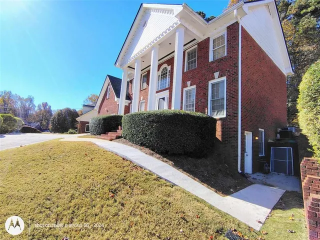 a view of living room with furniture and wooden floor