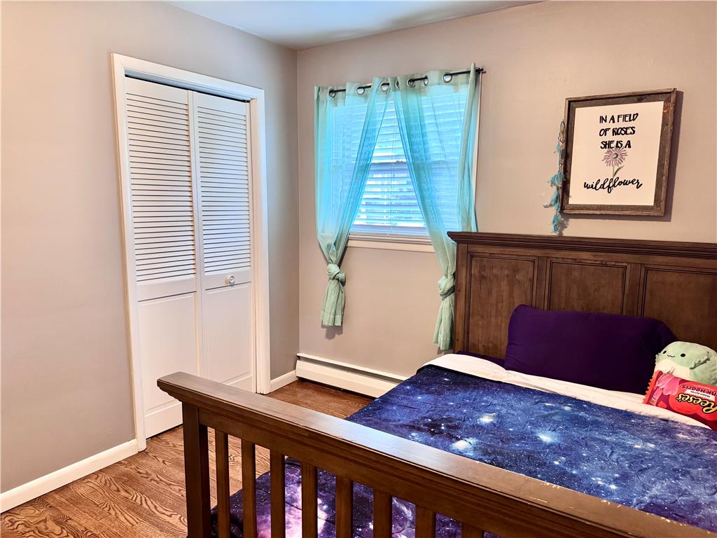 5334 Egypt Road Laurys Station, PA 18059 - Photo 30 of 55 Hardwood flooring grounds this cozy bedroom, featuring a bi-fold closet and ample natural light.
