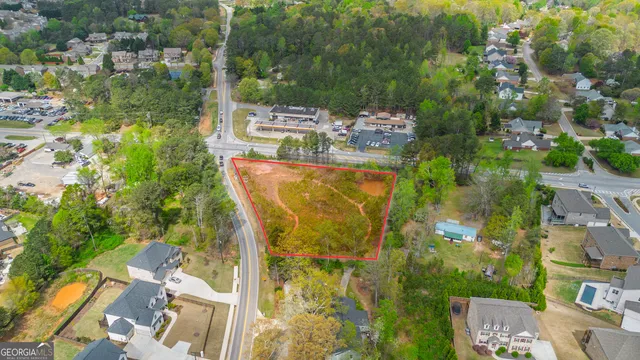 an aerial view of residential houses with outdoor space