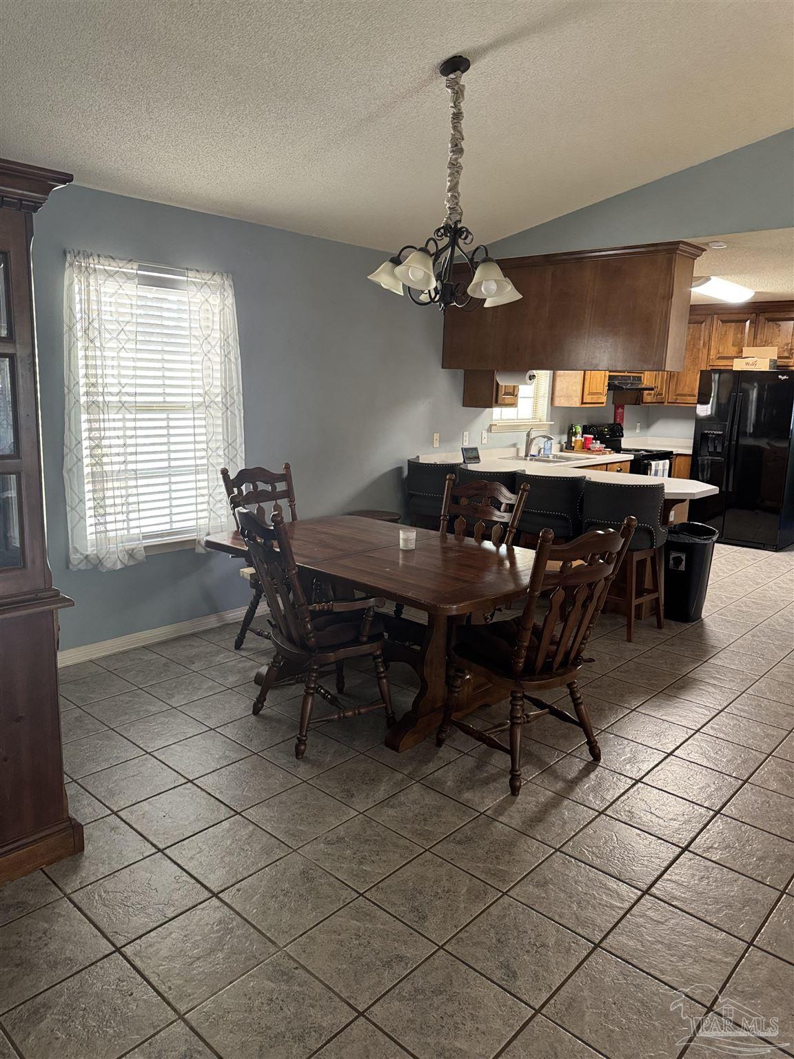 7551 McElhaney Road Century, FL 32535 - Photo 16 of 43 a view of a dining room with furniture