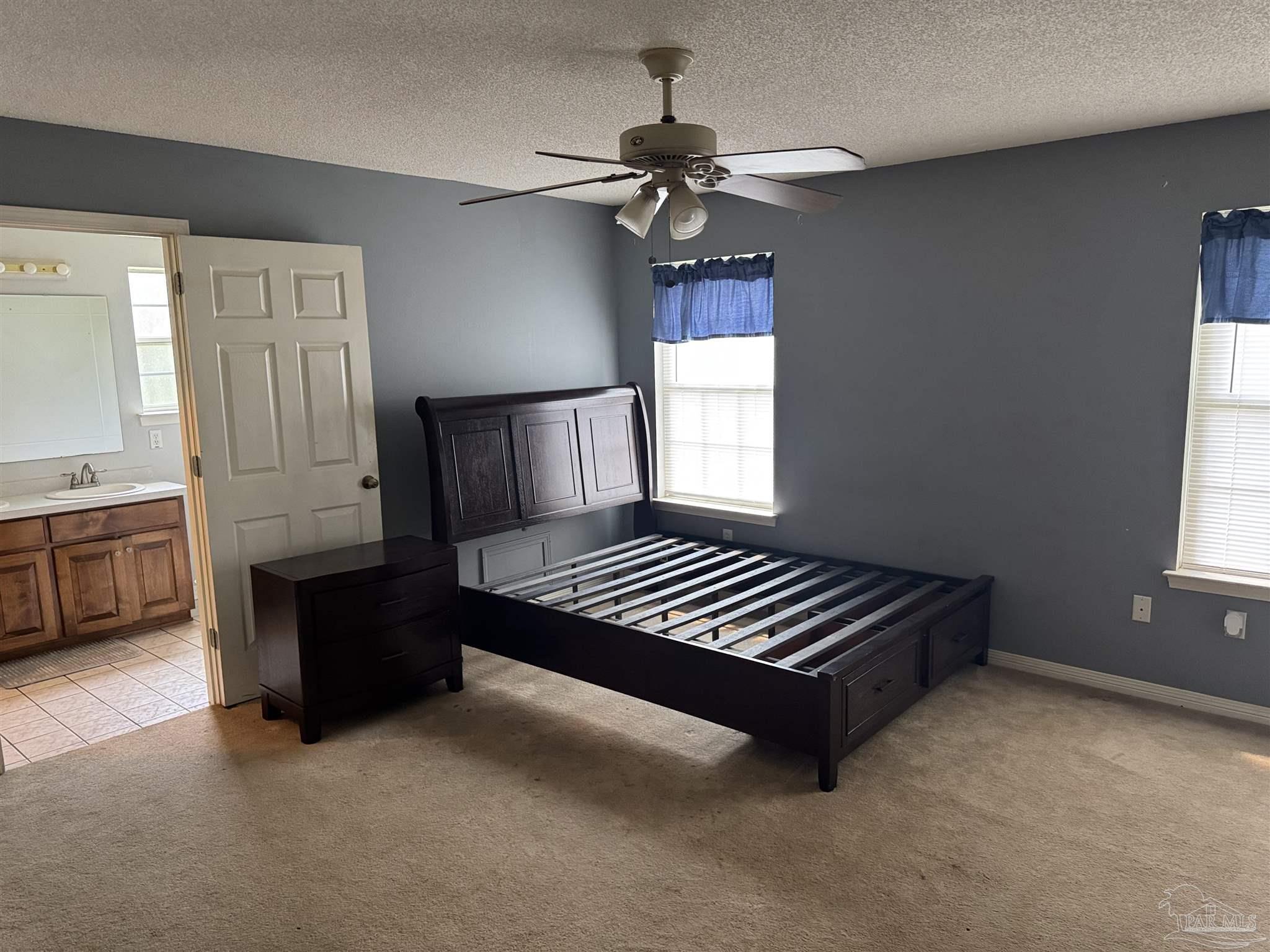 7551 McElhaney Road Century, FL 32535 - Photo 19 of 43 a living room with furniture and a window