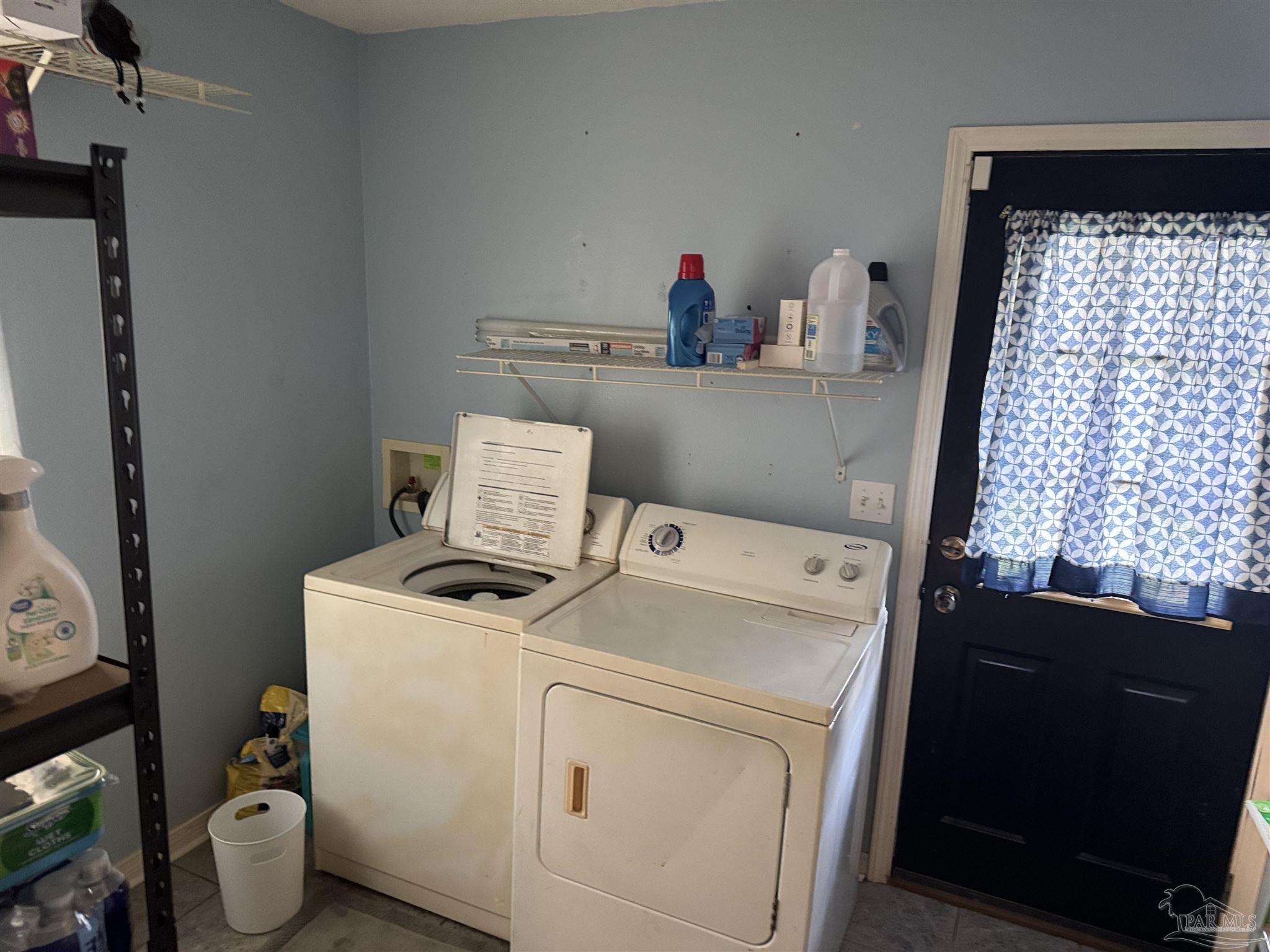 7551 McElhaney Road Century, FL 32535 - Photo 26 of 43 a utility room with dryer and washer