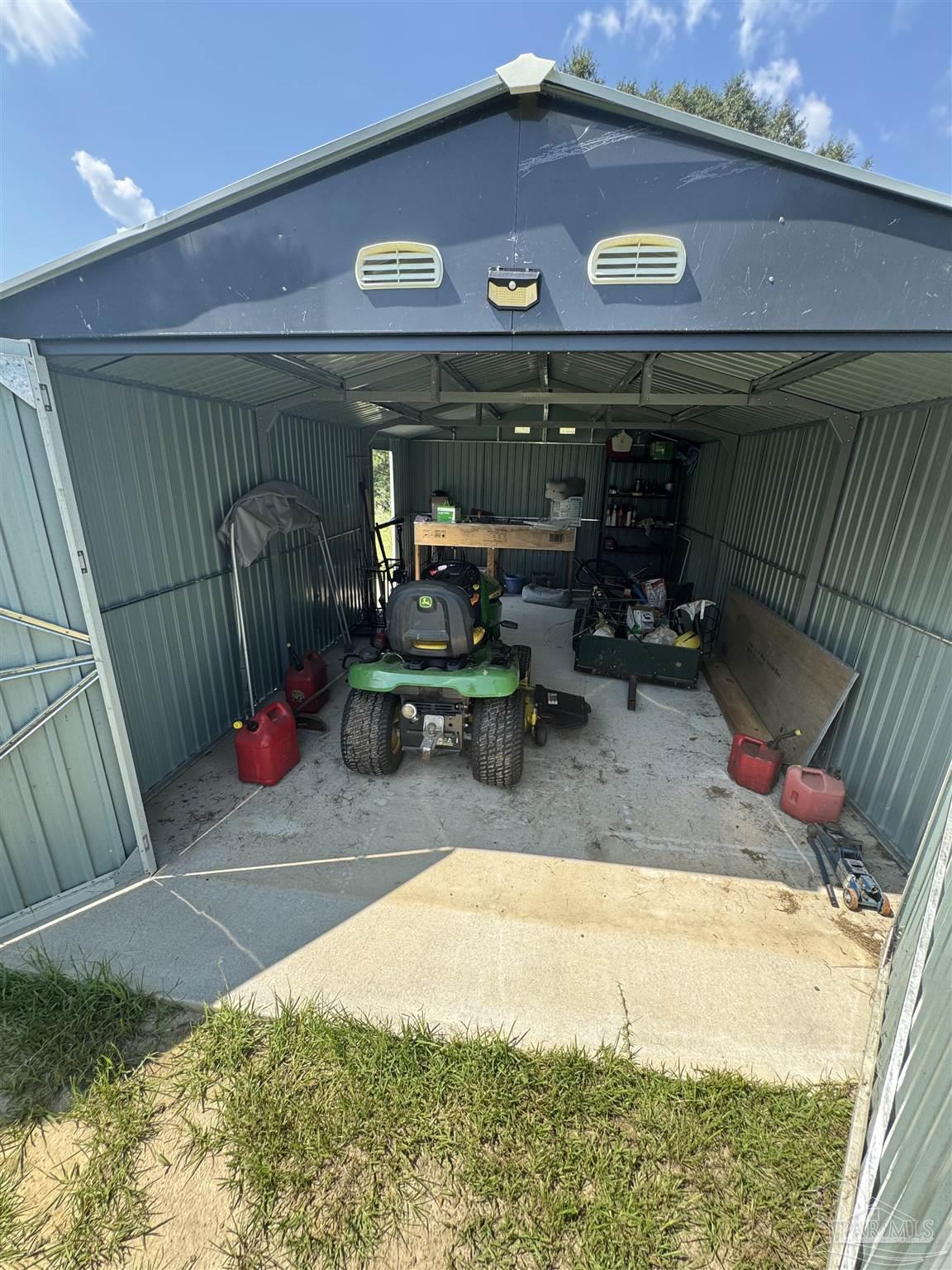 7551 McElhaney Road Century, FL 32535 - Photo 41 of 43 a view of a chairs and table in patio