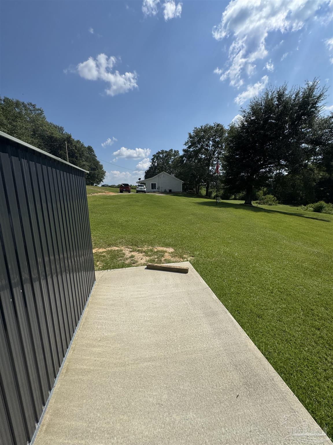 7551 McElhaney Road Century, FL 32535 - Photo 42 of 43 a view of a backyard with a garden