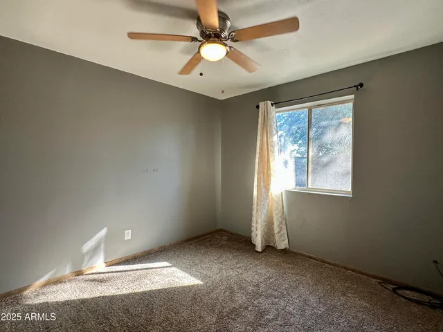 an empty room with a empty space and a window