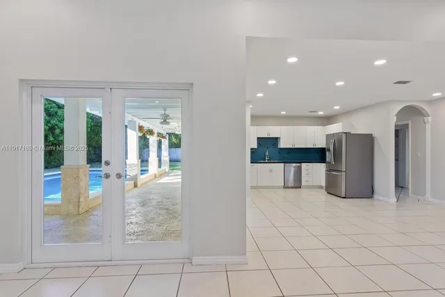 a view of a livingroom with kitchen and furniture