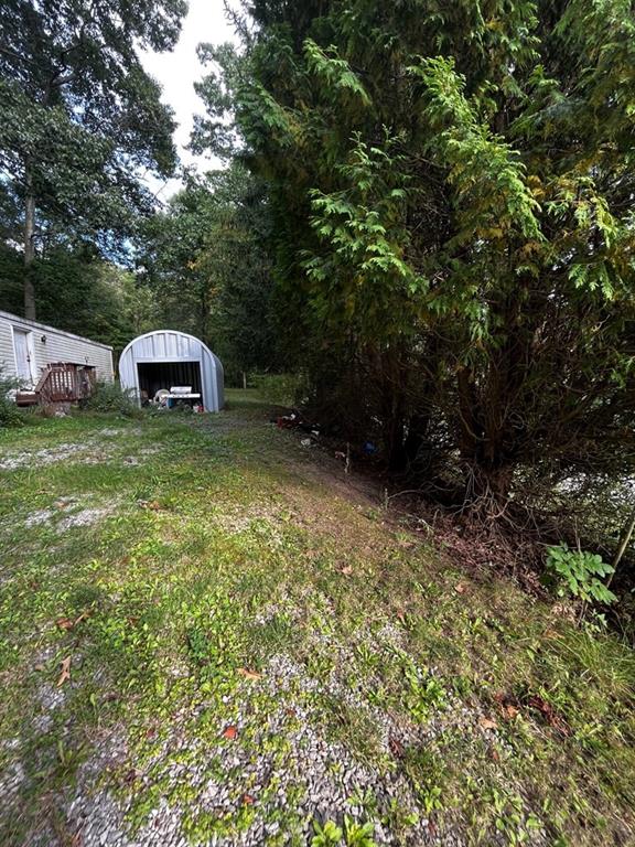 245 Schlemmer Road Rural Valley, PA 16249 - Photo 5 of 16 a view of a garden with an outdoor space