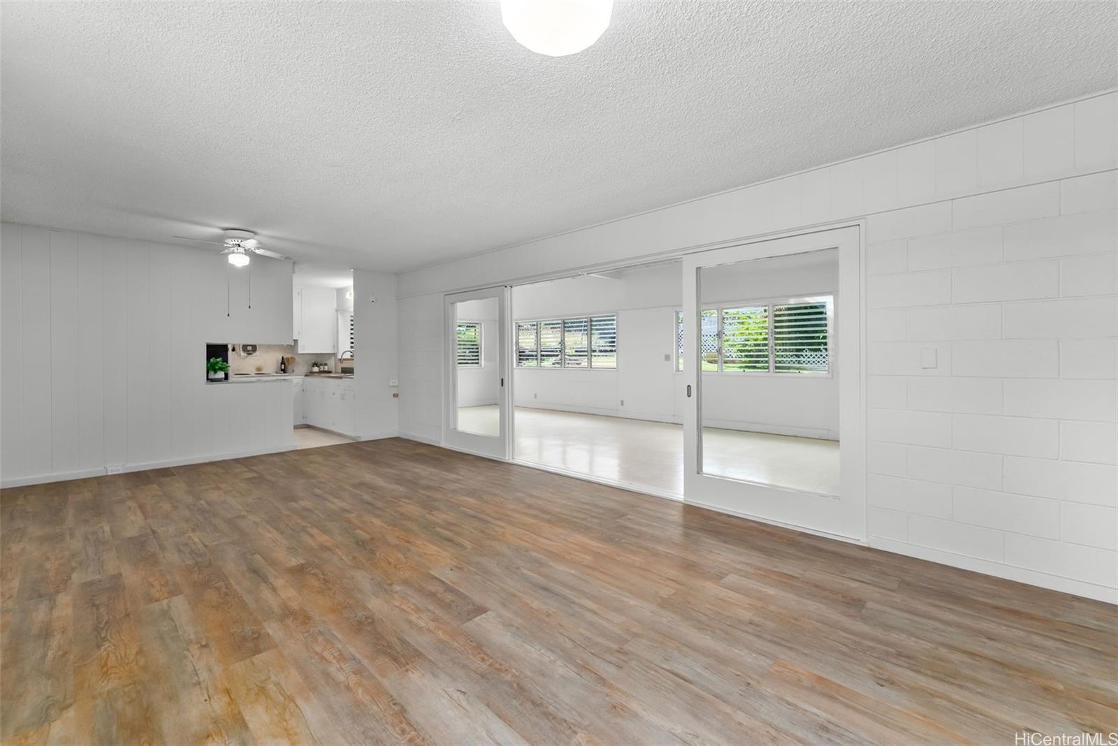 6014 Aimoku Street Honolulu, HI 96821 - Photo 13 of 25 Living room looking towards the sun room/family room