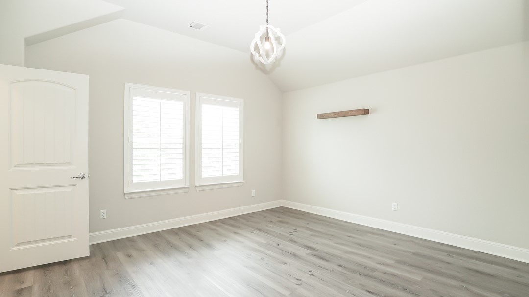 629 Germander Road Leander, TX 78641 - Photo 24 of 38 an empty room with wooden floor and windows
