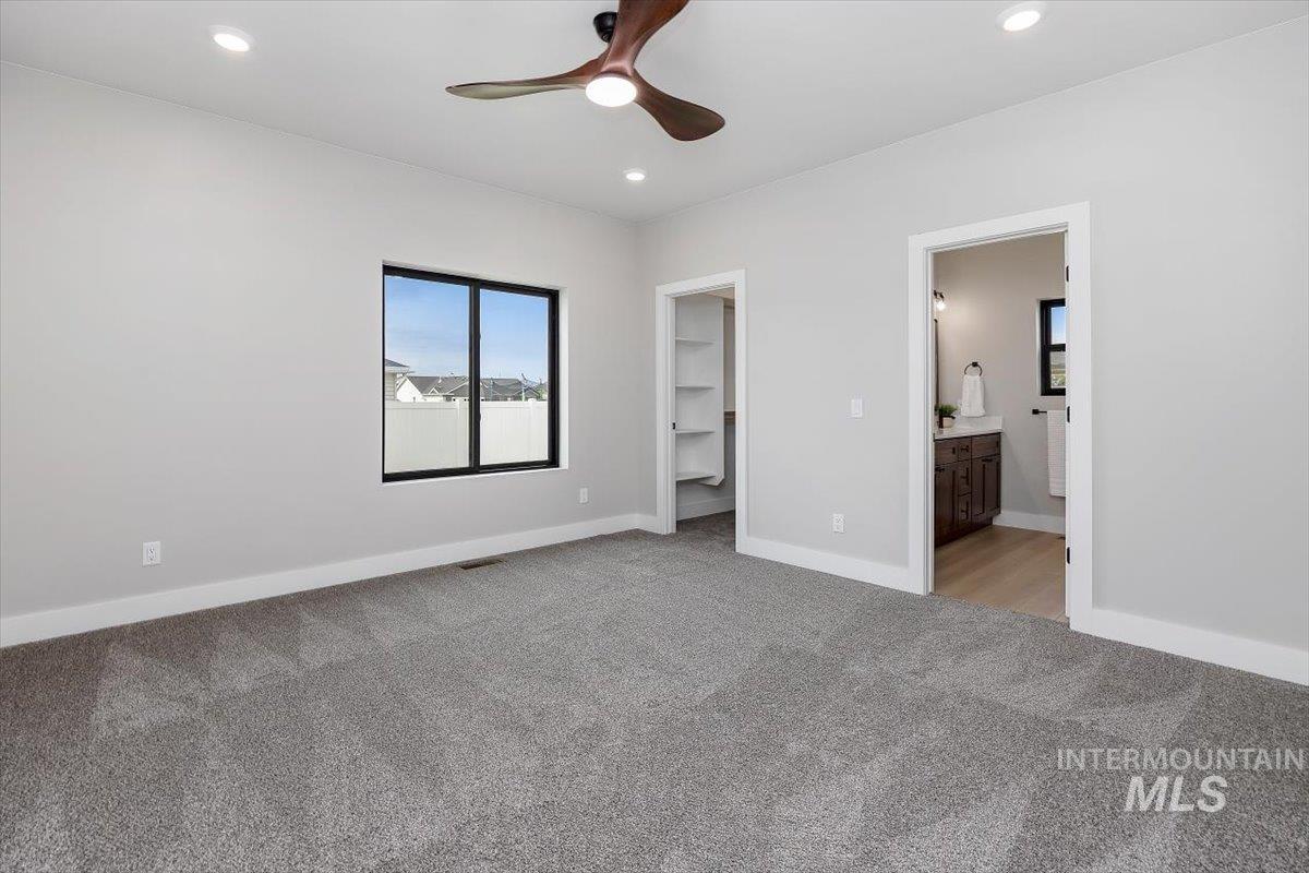 1201 Jade Drive Rupert, ID 83350 - Photo 15 of 27 Spacious room featuring plush gray carpeting, recessed lighting, and a modern ceiling fan