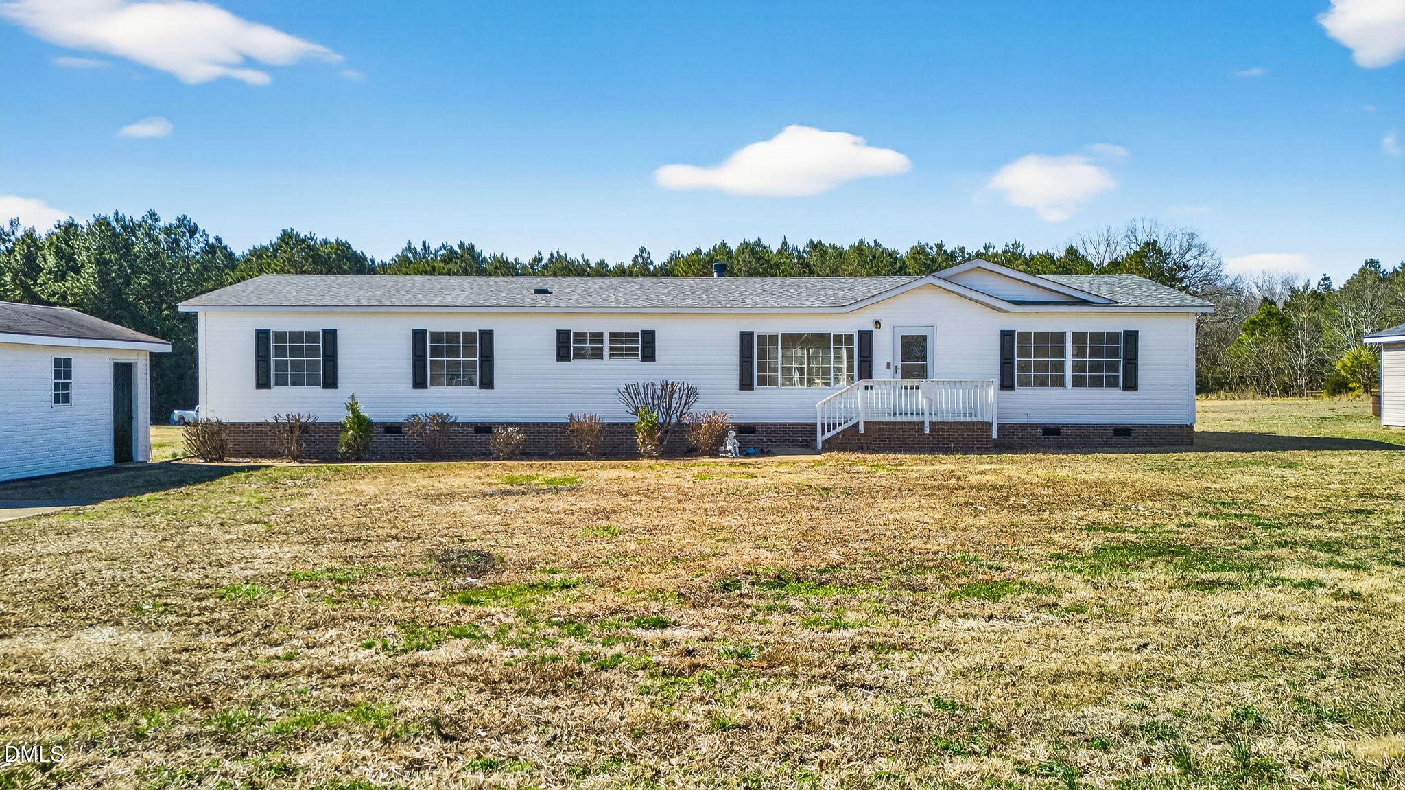 10015 Smith Road Middlesex, NC 27557 - Photo 1 of 48 a front view of a house with a yard