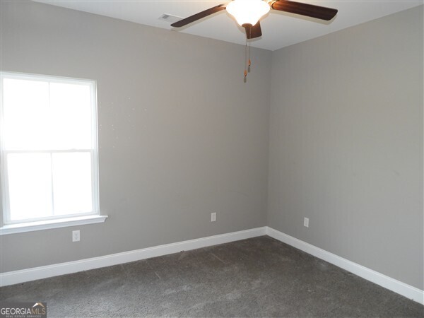 5915 Rye Patch Road Ludowici, GA 31316 - Photo 7 of 25 an empty room with a window