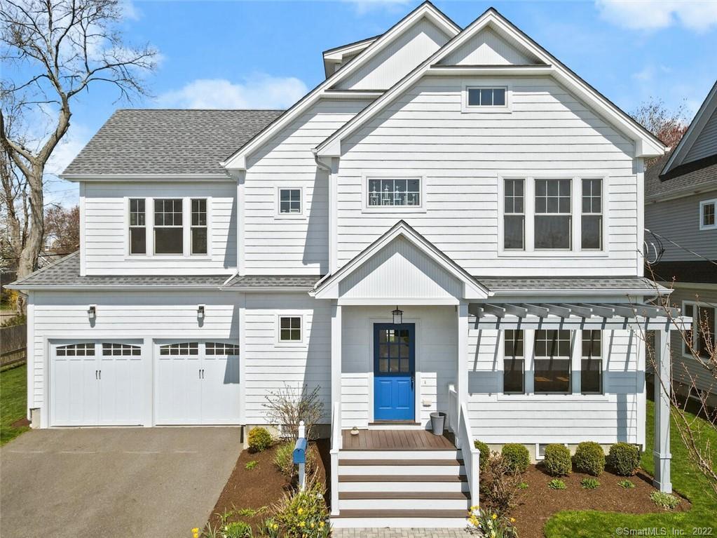 front view of a house with a yard
