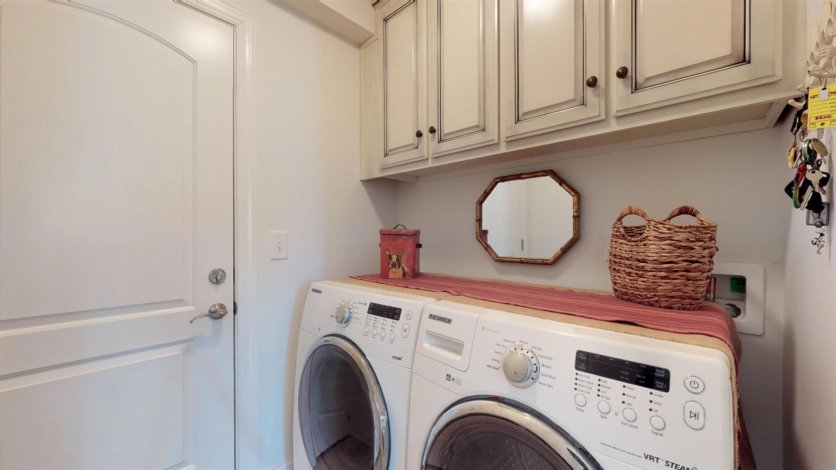 1065 Irish Way Spring Hill, TN 37174 - Photo 12 of 28 a view of washer and dryer with kitchen in the background