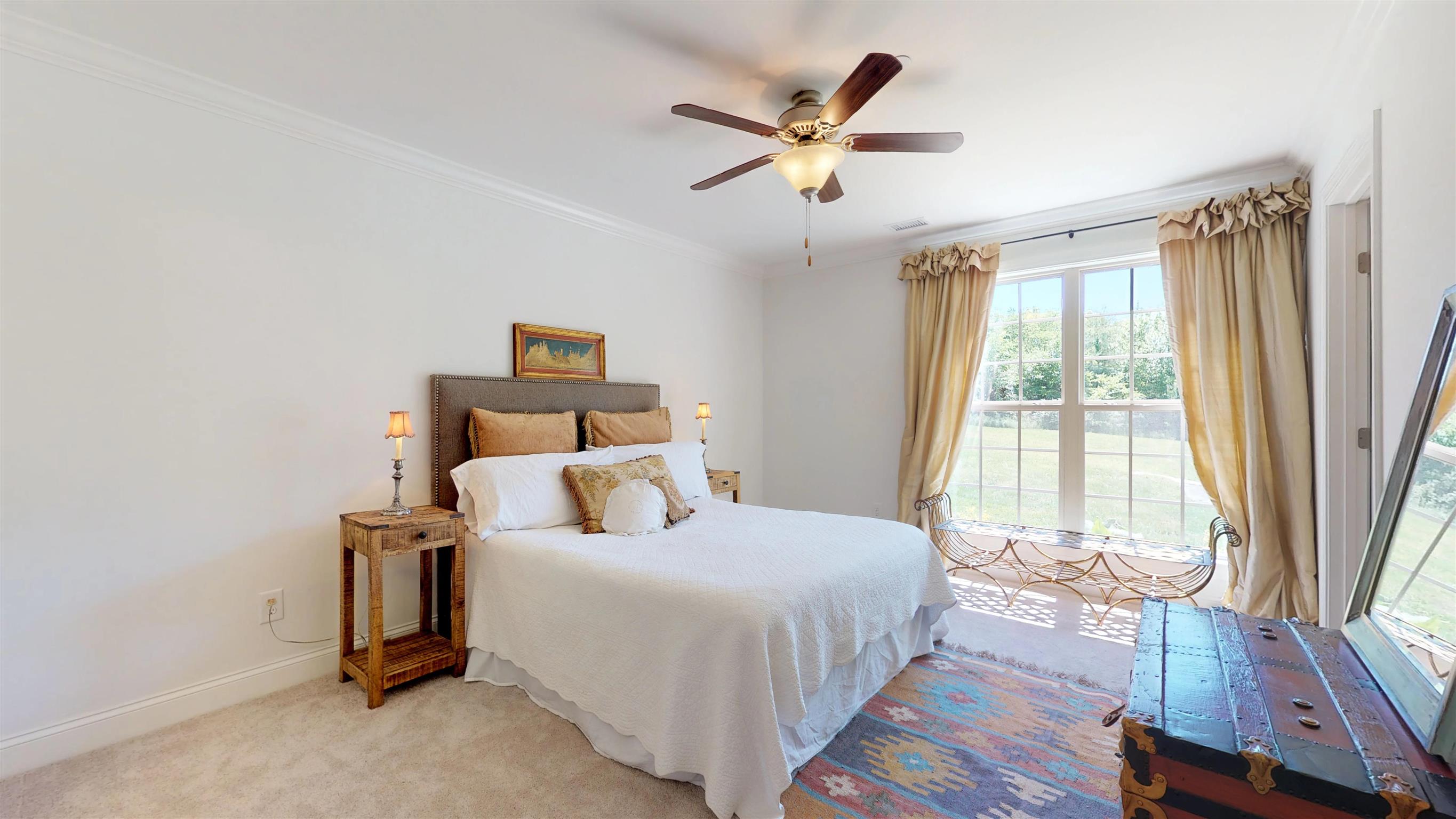 1065 Irish Way Spring Hill, TN 37174 - Photo 13 of 28 a bedroom with a large bed and a large window