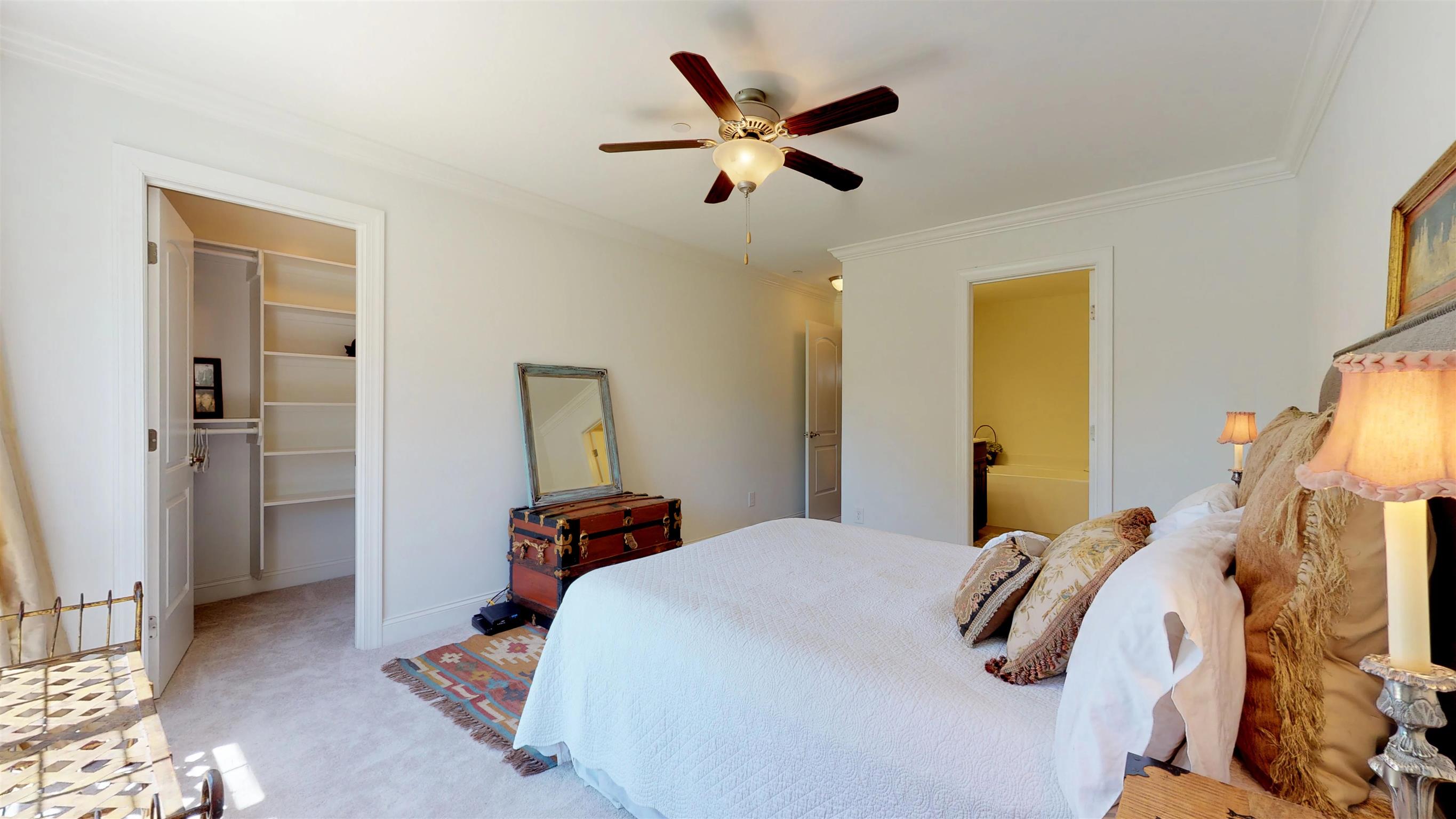 1065 Irish Way Spring Hill, TN 37174 - Photo 14 of 28 a bedroom with a bed and a chandelier