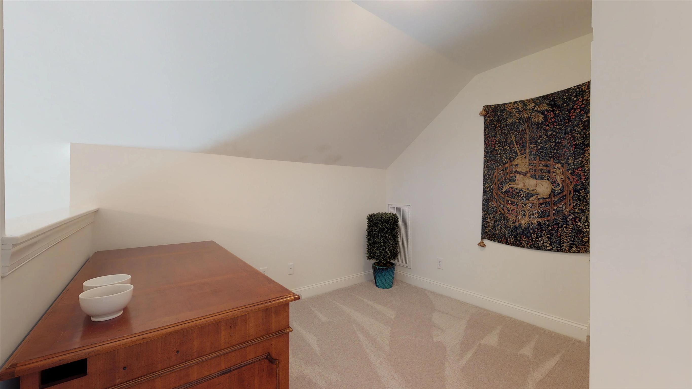 1065 Irish Way Spring Hill, TN 37174 - Photo 17 of 28 a bedroom with a bed and cabinets