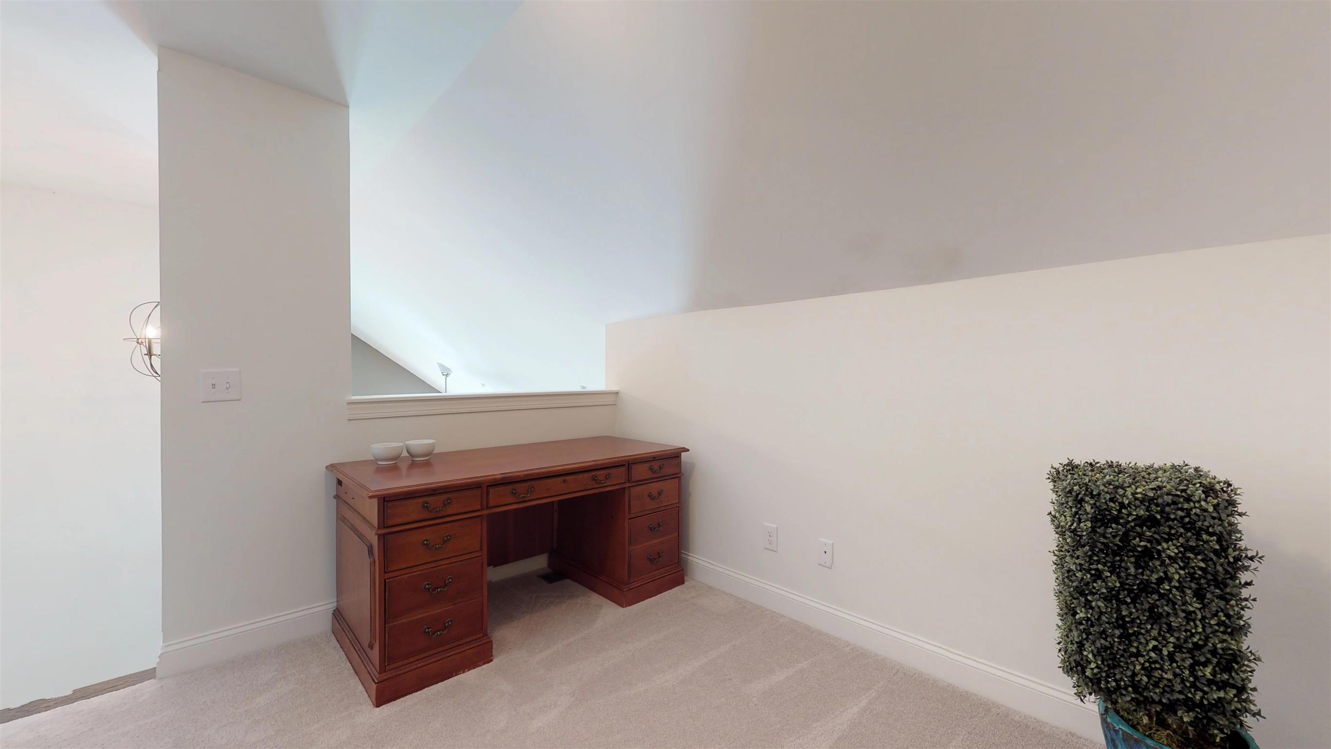 1065 Irish Way Spring Hill, TN 37174 - Photo 18 of 28 a room with a table and a fireplace