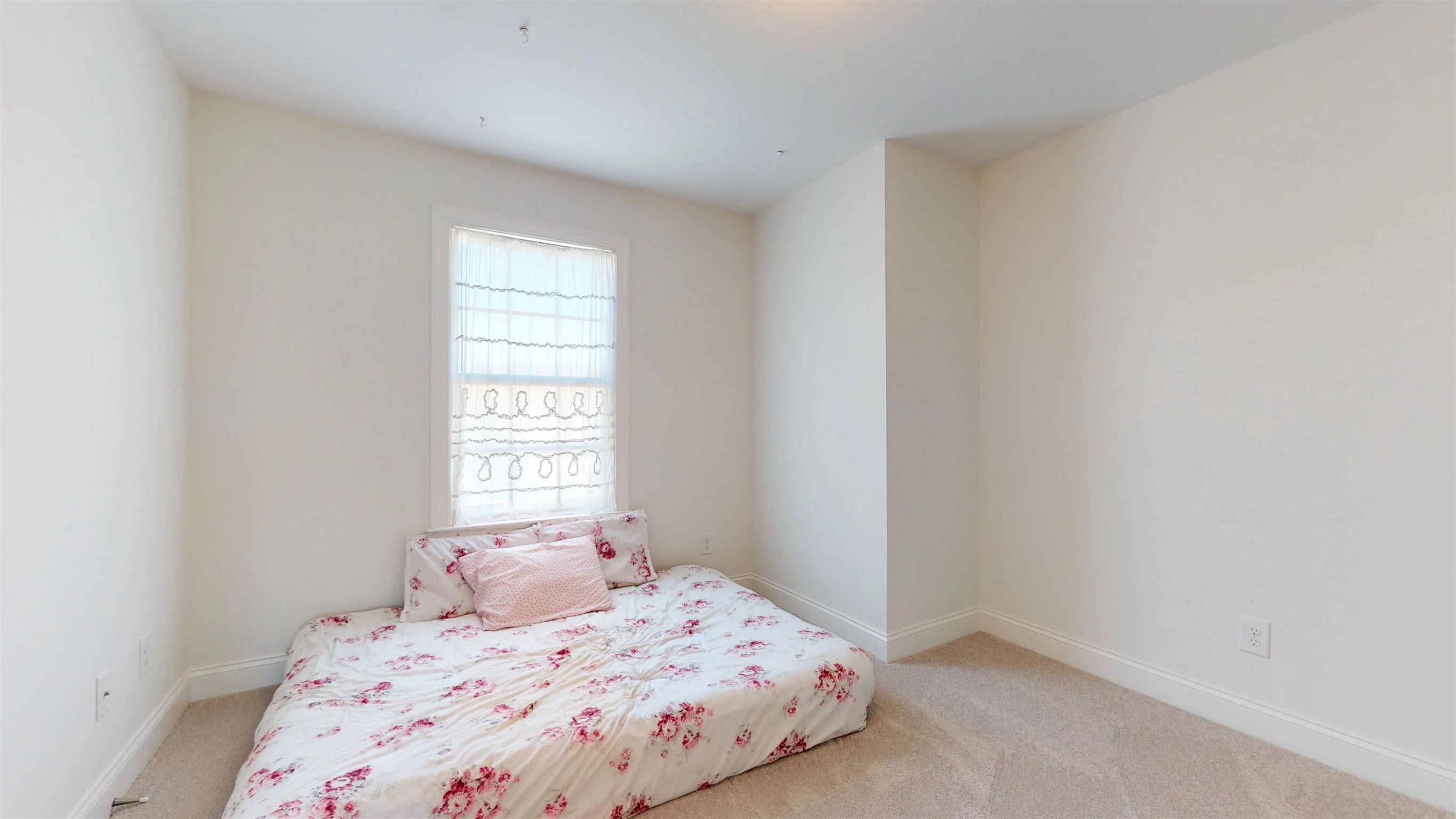 1065 Irish Way Spring Hill, TN 37174 - Photo 19 of 28 a bedroom with a bed and a window
