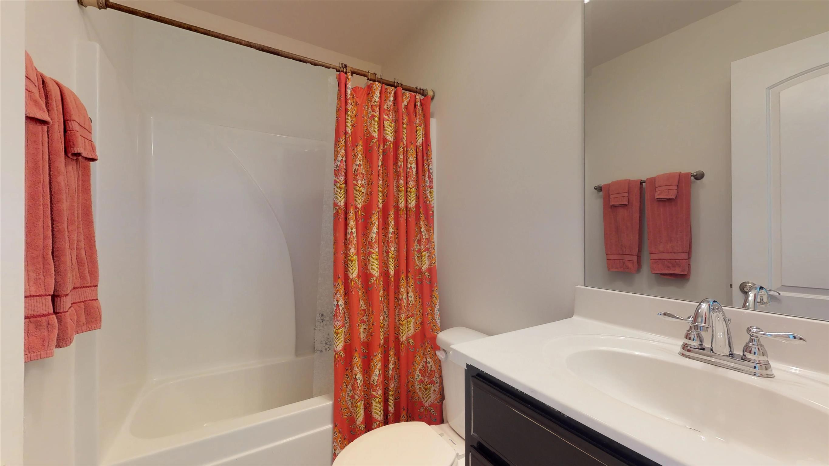 1065 Irish Way Spring Hill, TN 37174 - Photo 21 of 28 a bathroom with a sink a toilet and shower