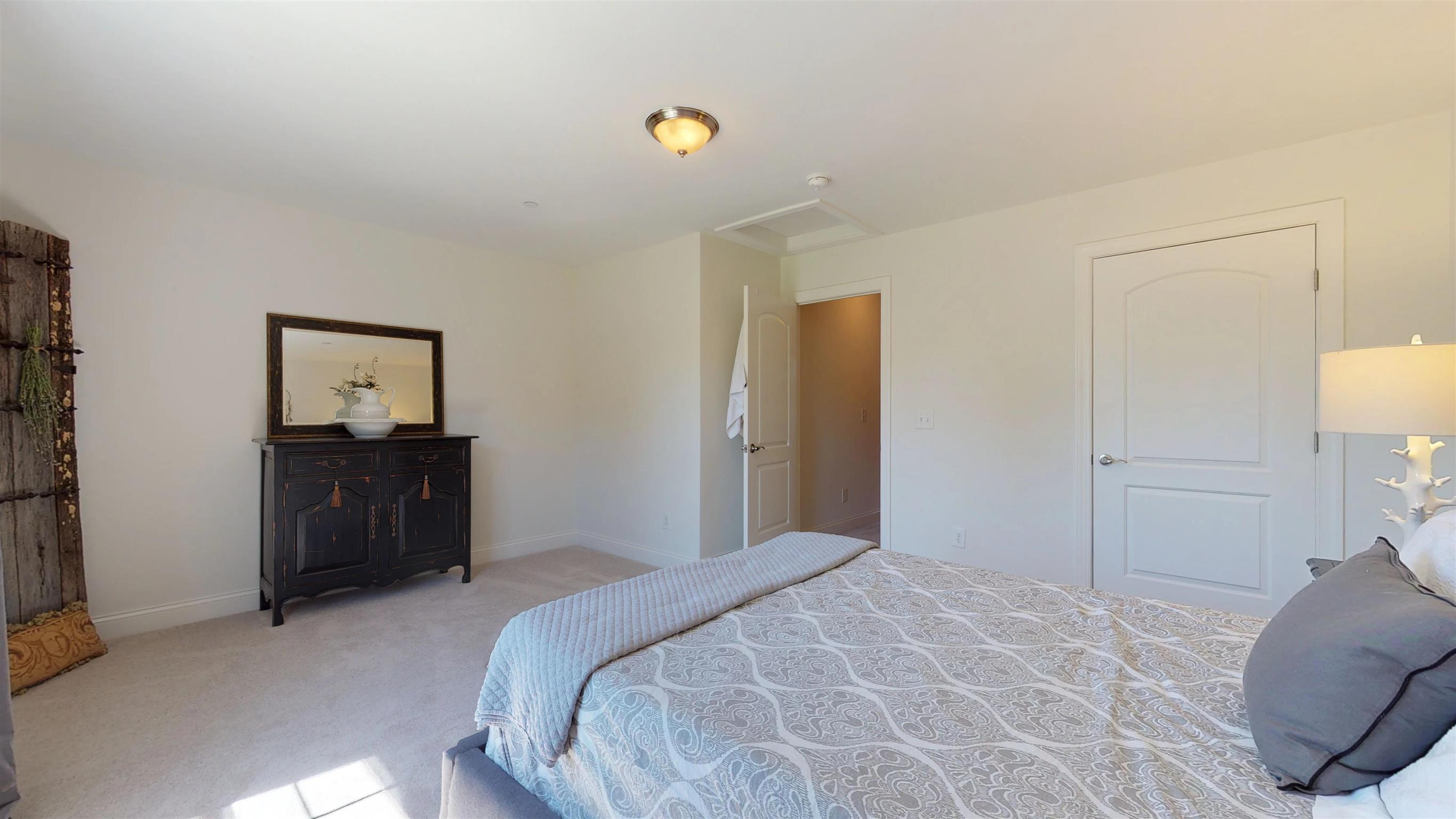 1065 Irish Way Spring Hill, TN 37174 - Photo 23 of 28 a bedroom with a bed and painting on the wall