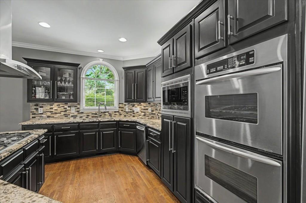 122 Ridge View Drive Ball Ground, GA 30107 - Photo 24 of 84 a kitchen with stainless steel appliances granite countertop a stove and a refrigerator