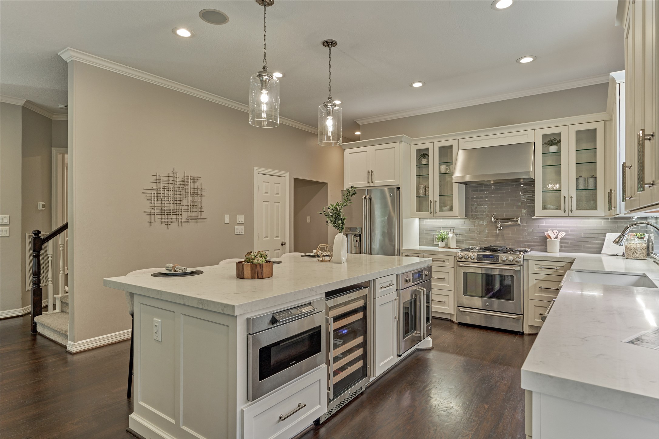 7 Gentry Oak Court Spring, TX 77381 - Photo 19 of 50 a kitchen with a stove and a sink