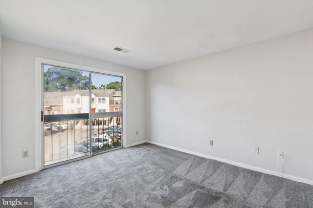 an empty room with a fireplace