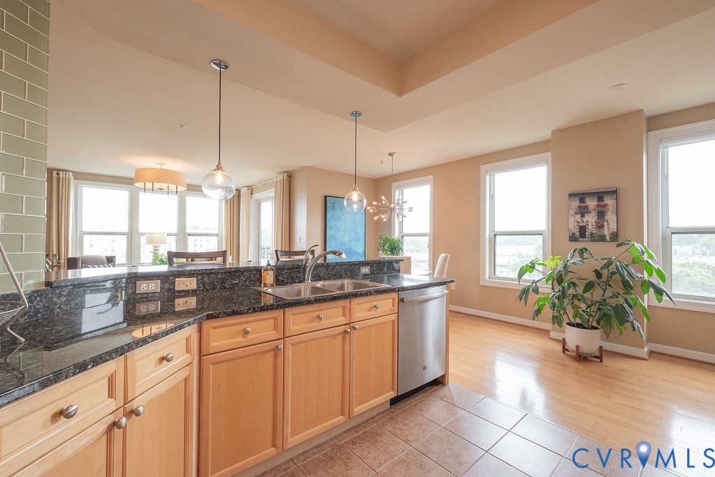 4820 Old Main Street, Unit 511 Henrico, VA 23231 - Photo 13 of 51 a large kitchen with granite countertop a sink and white cabinets